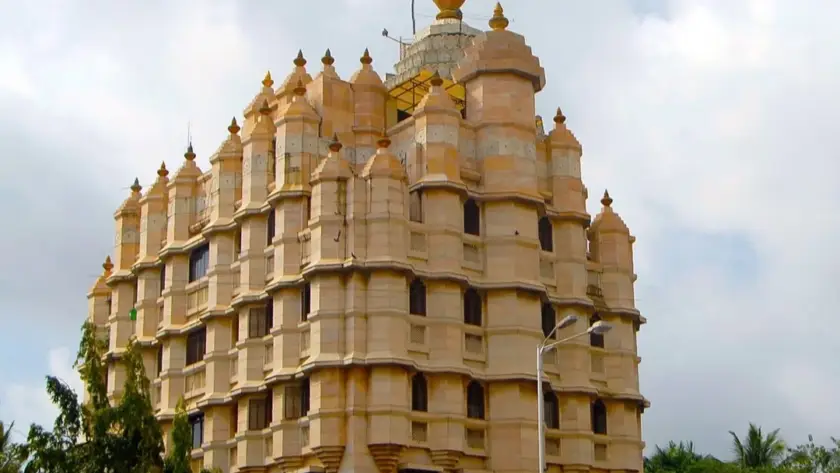 Temple sound system with discreet ceiling speakers carrying mantras through a marble prayer hall