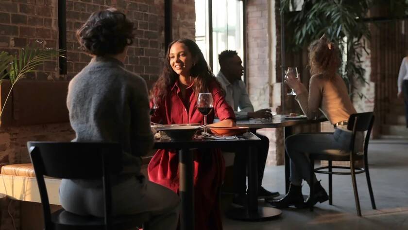 Small cafe interior with ceiling speakers giving even background music over seated guests